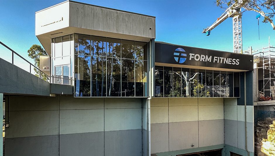 Our Work 6 Before gym repainting – faded and worn exterior needing a fresh look.